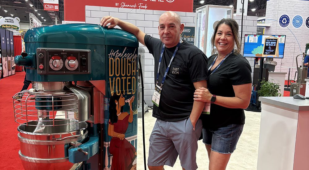 Image of winner with the Hobart Legacy+® HL662 60-quart pizza dough mixer during Pizza Expo.